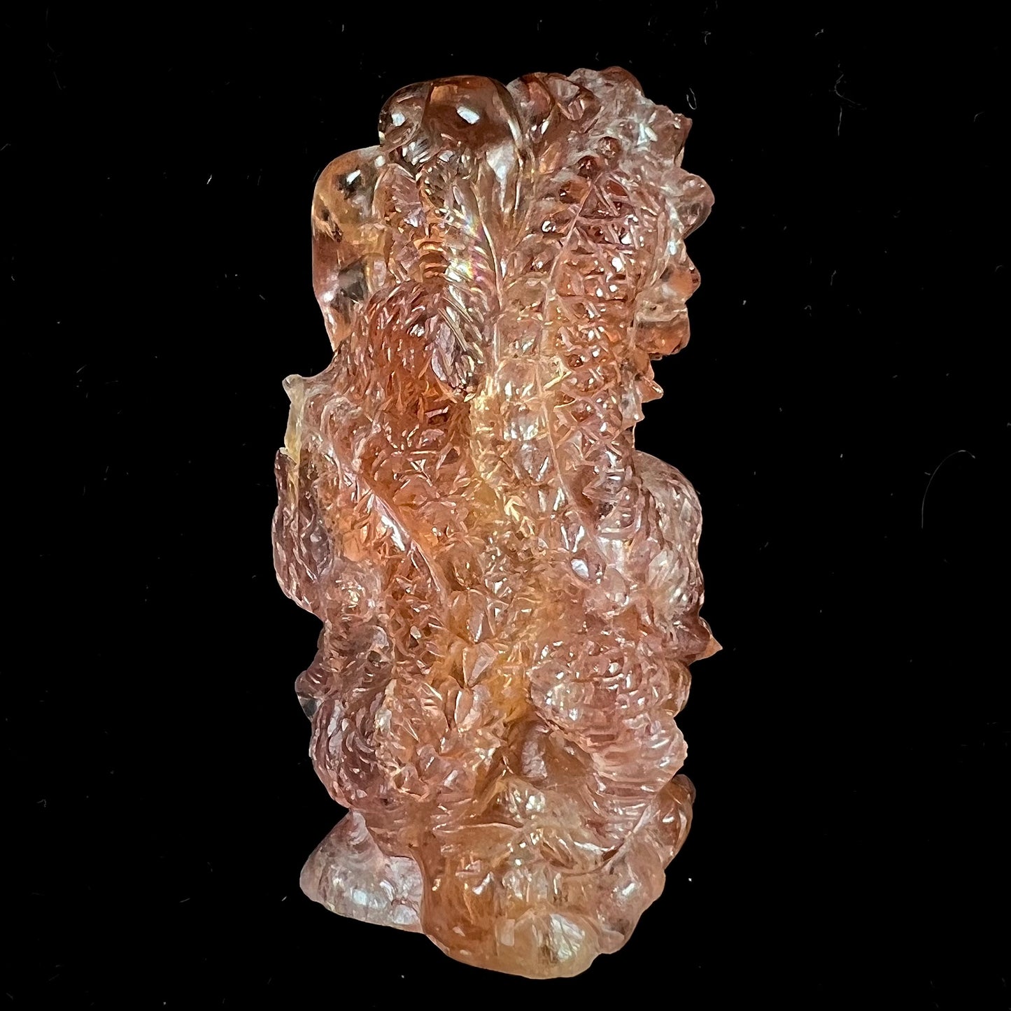 A dragon carved by Ronald Stevens from imperial topaz crystal.