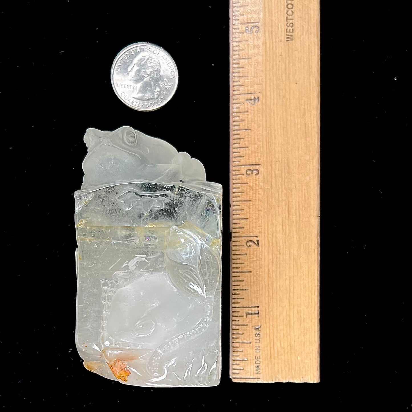 A frog carved from natural white topaz crystal.