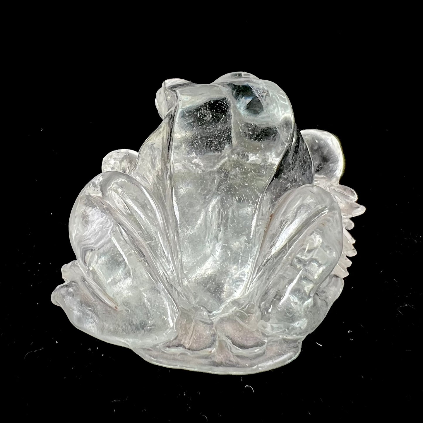 A crystal frog carved from topaz by artist Ronald Stevens.