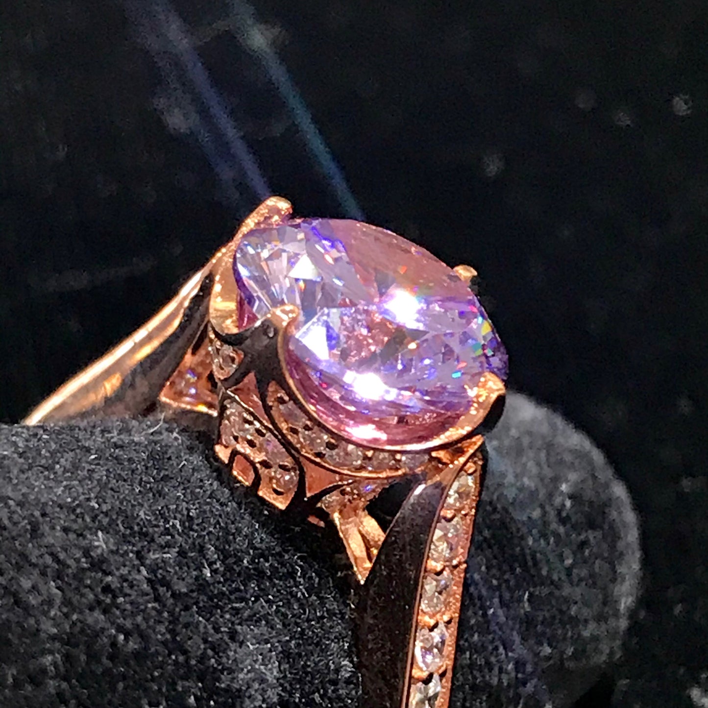 Purple CZ ring with white CZ side stones. Rose gold plated over sterling silver.