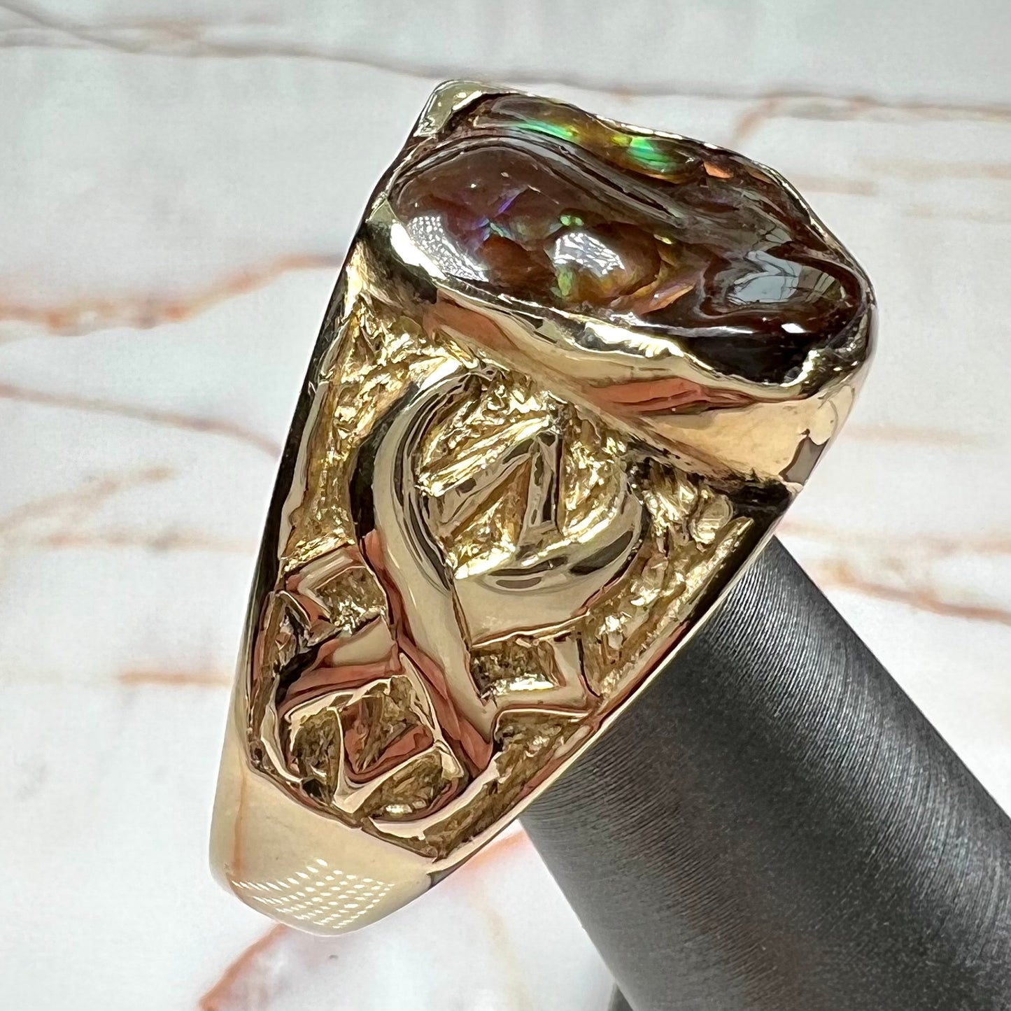 Custom, heavy yellow gold men's ring set with fire agate from Deer Creek, Arizona.