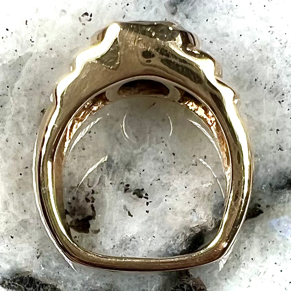 Men's fire agate solitaire ring cast in yellow gold. The ring is a step design.