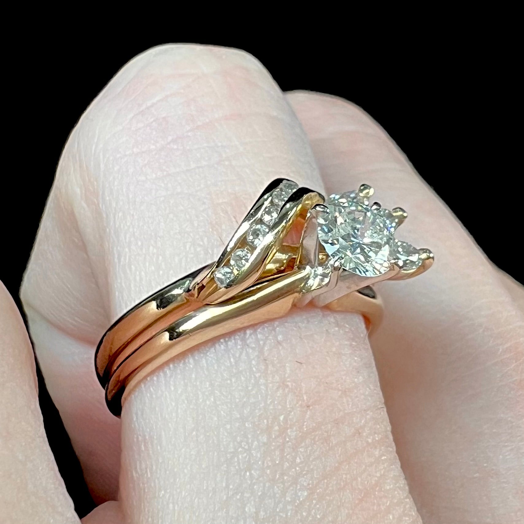 A ladies' diamond wedding set that has been soldered together in yellow gold.  There are round and marquise cut diamonds.