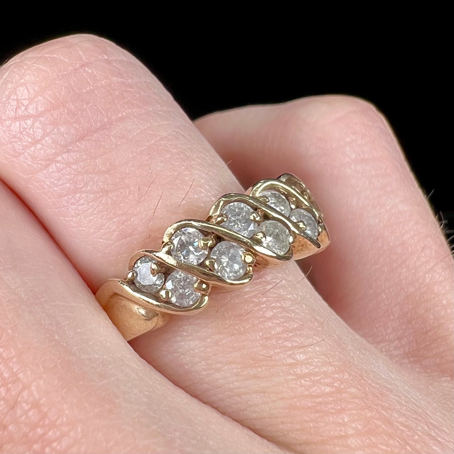 A ladies' estate yellow gold band set with 1 total carat of round brilliant cut diamonds.