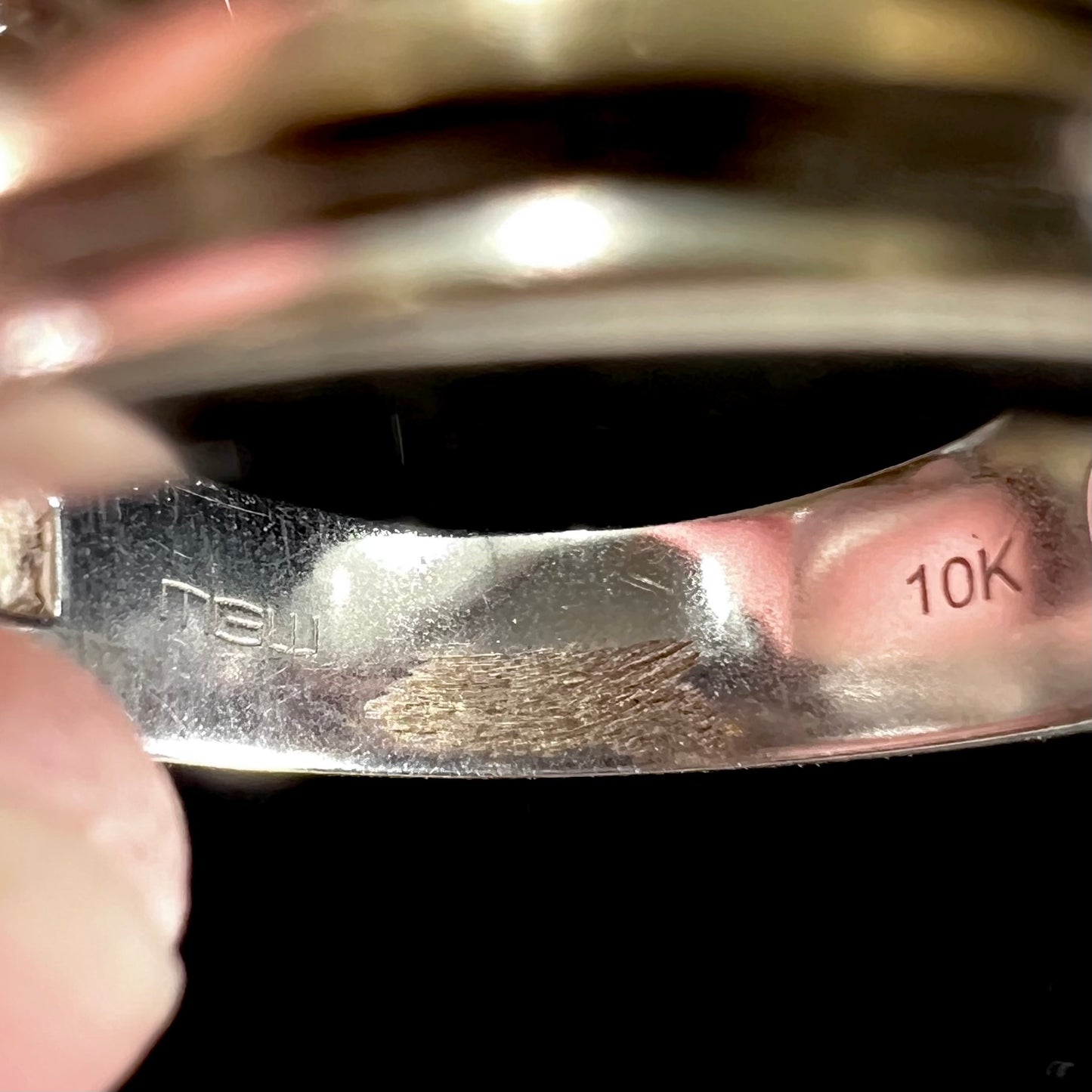 A men's estate white gold five stone diamond ring.