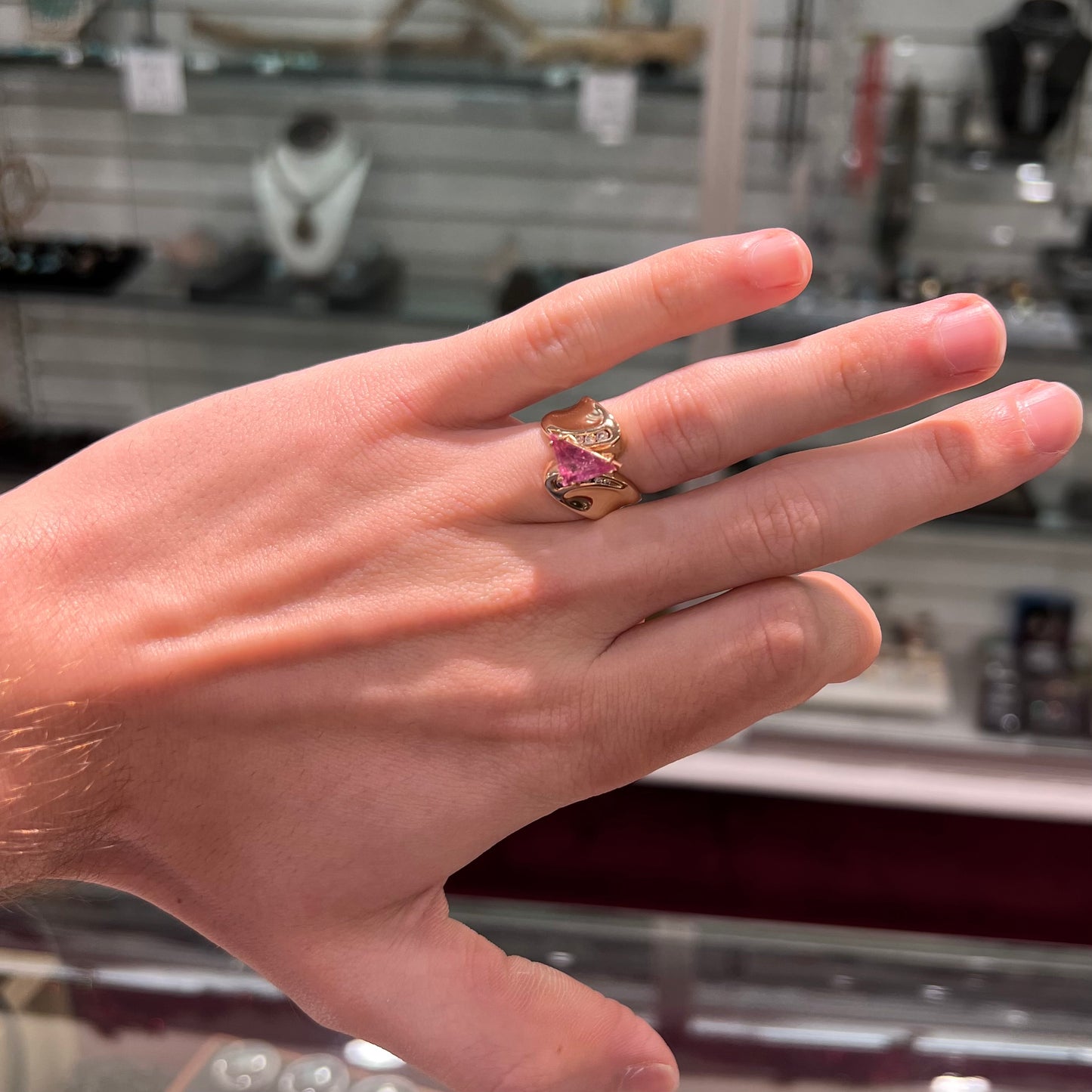 An estate yellow gold and diamond triangle cut Pala pink tourmaline ladies' ring.
