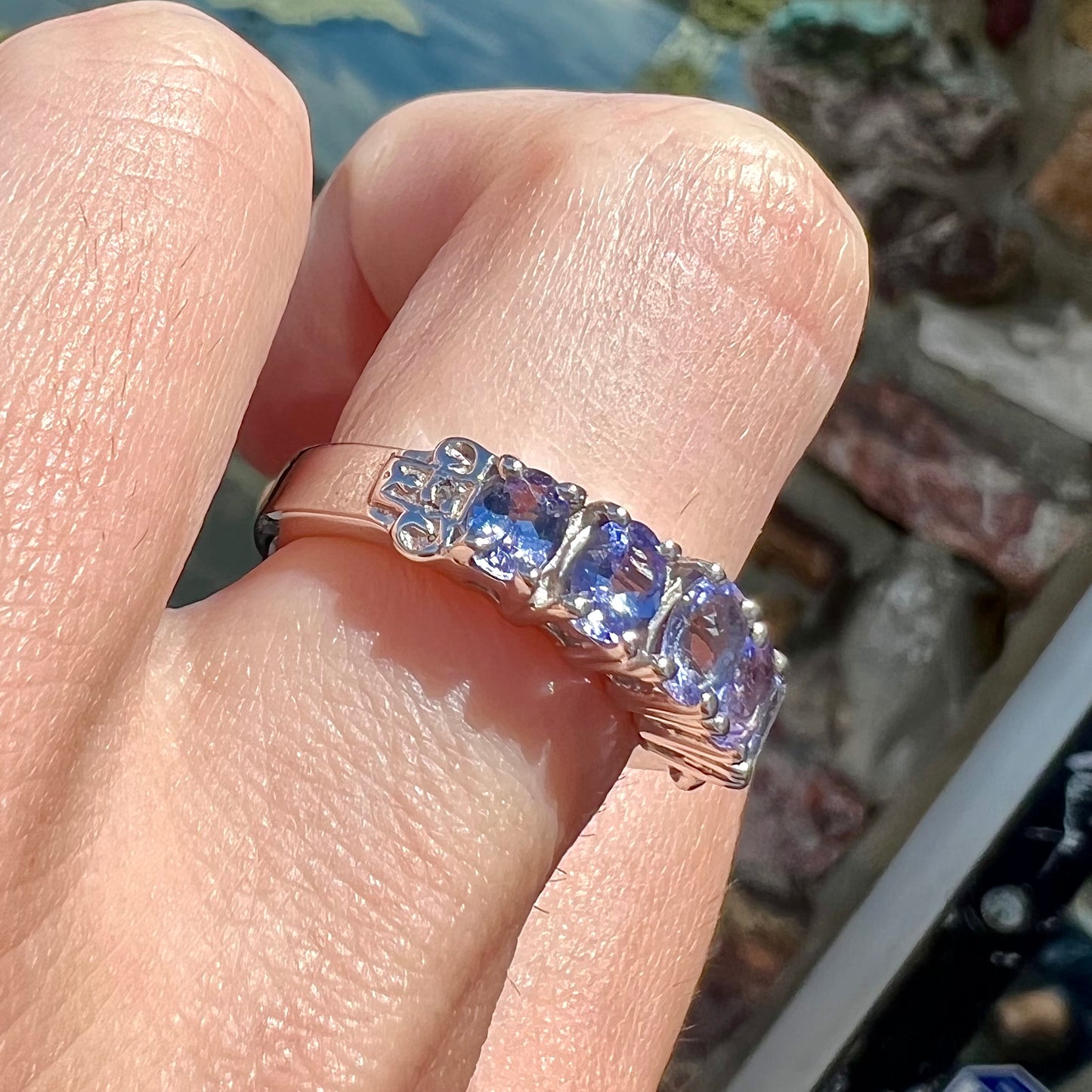 A sterling silver five stone oval cut tanzanite ring.