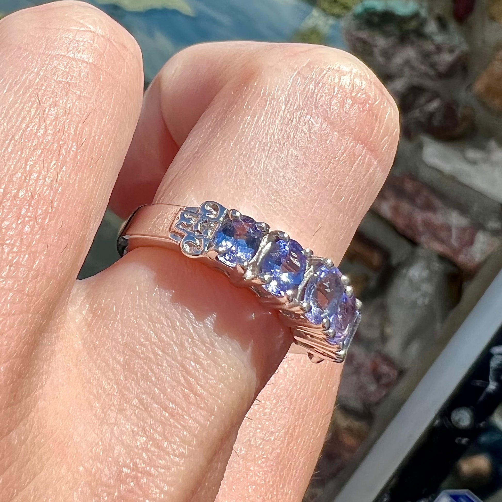A sterling silver five stone oval cut tanzanite ring.