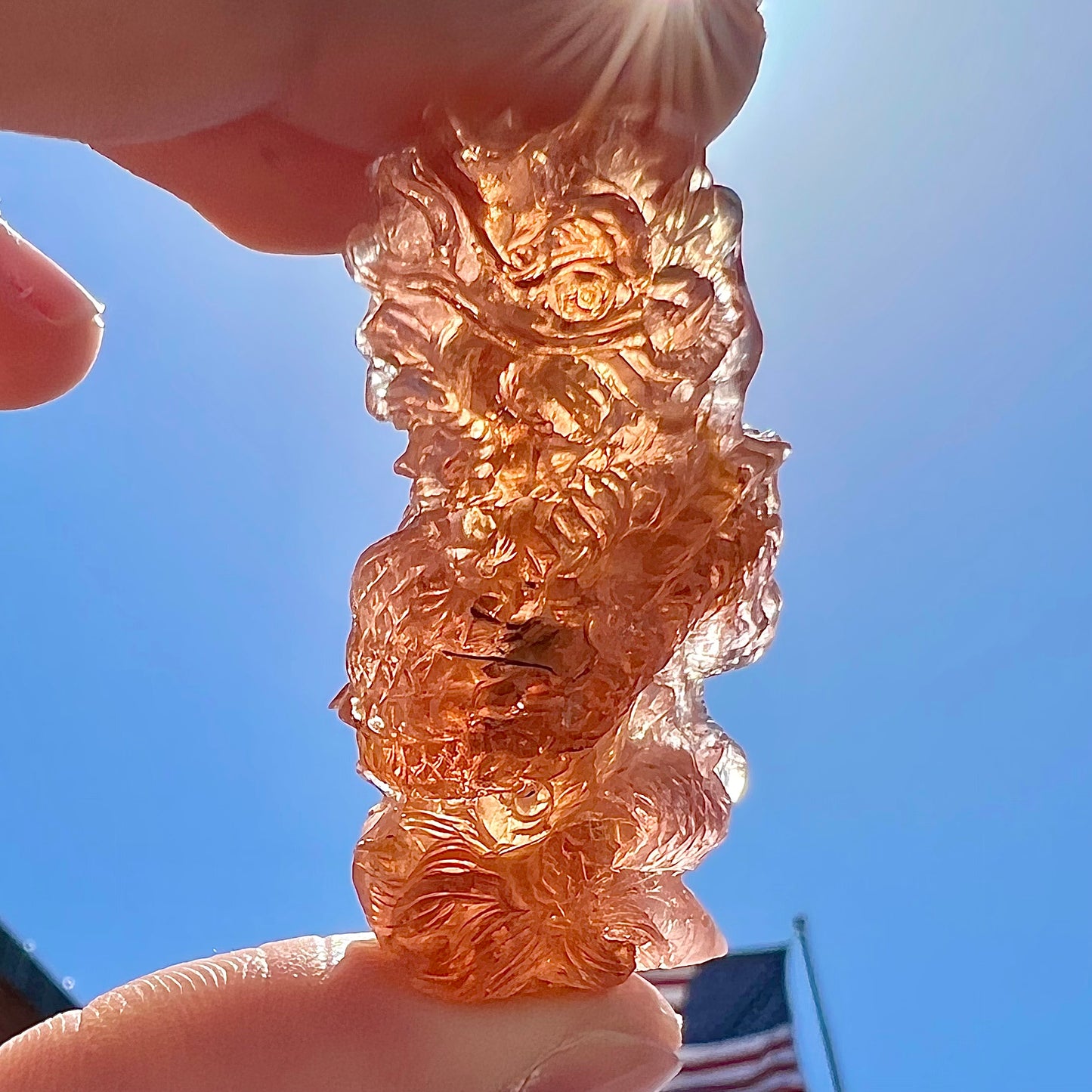A dragon carved by Ronald Stevens from imperial topaz crystal.