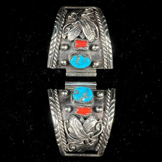 A pair of sterling silver watch cuff parts set with turquoise and coral stones handmade by Navajo artist, Genieve Werito.
