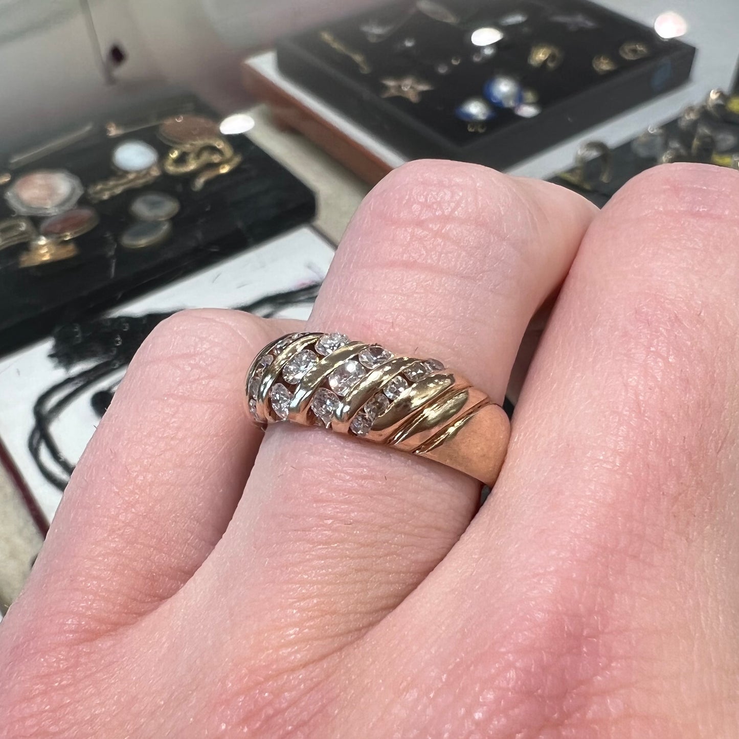 A ladies' channel set gold diamond ring.