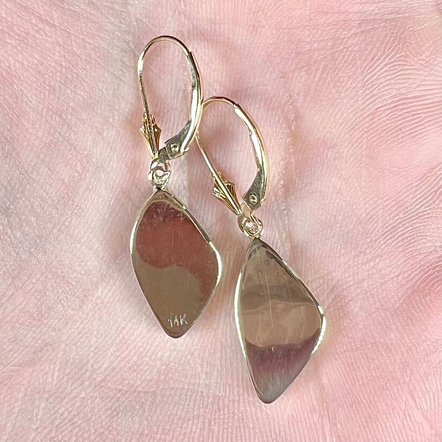 A pair of yellow gold dangle earrings set with Australian boulder opal stones.