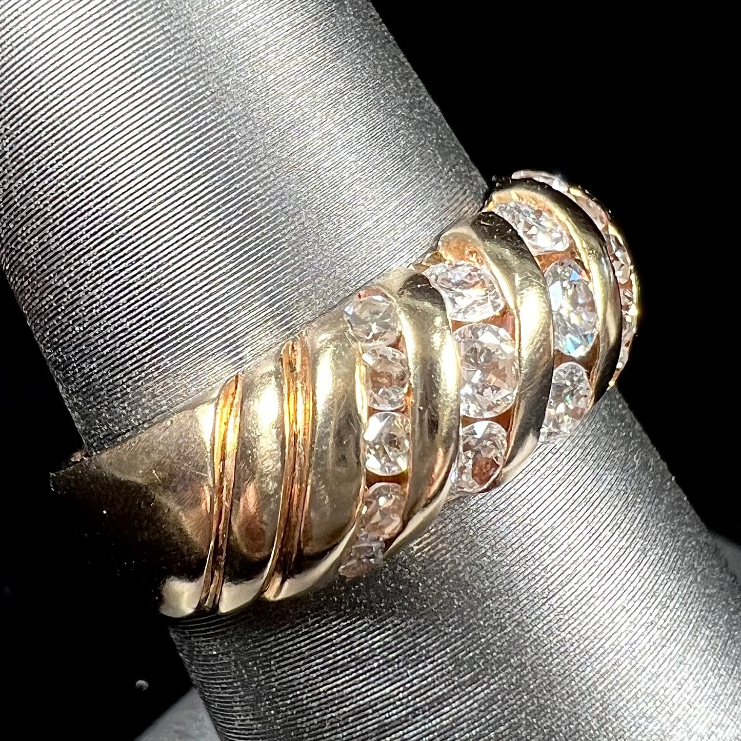 A ladies' channel set gold diamond ring.