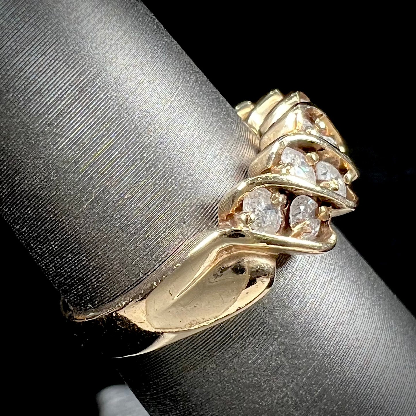 A ladies' estate yellow gold band set with 1 total carat of round brilliant cut diamonds.