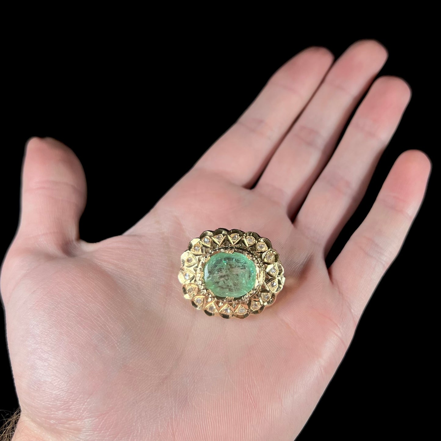 An antique 1800's Victorian emerald and diamond crystal brooch made in 18kt yellow gold.