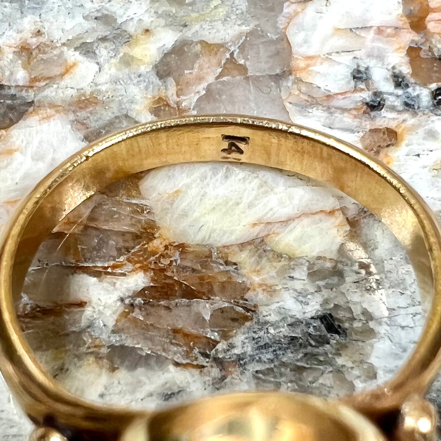 A ladies' yellow gold turquoise ring. The turquoise is a round cabochon cut.
