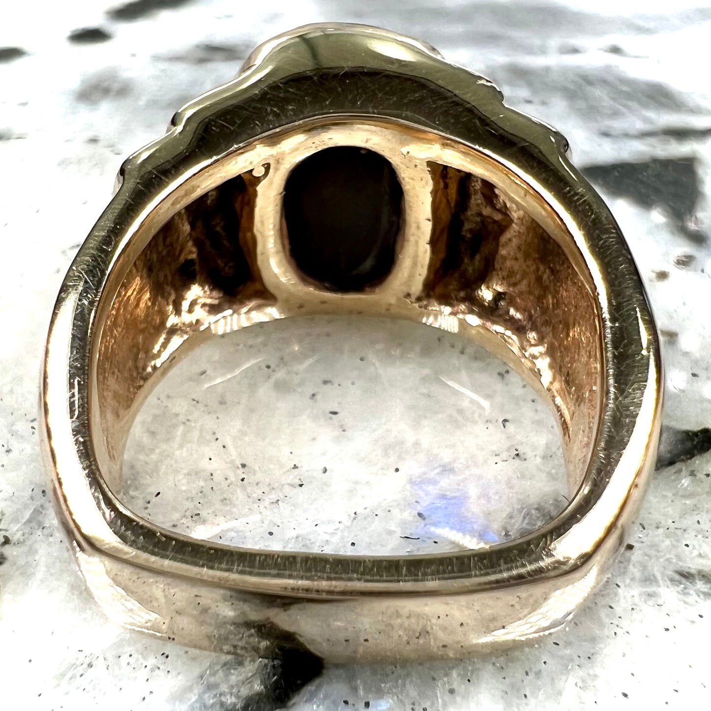 Men's fire agate solitaire ring cast in yellow gold. The ring is a step design.