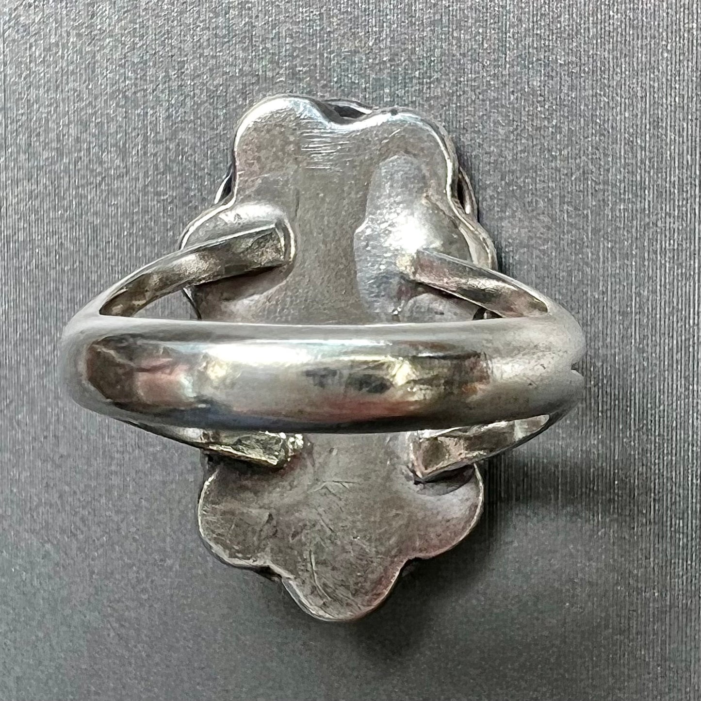 A handmade, split shank, sterling silver ring bezel set with a green variscite stone from Utah, USA.