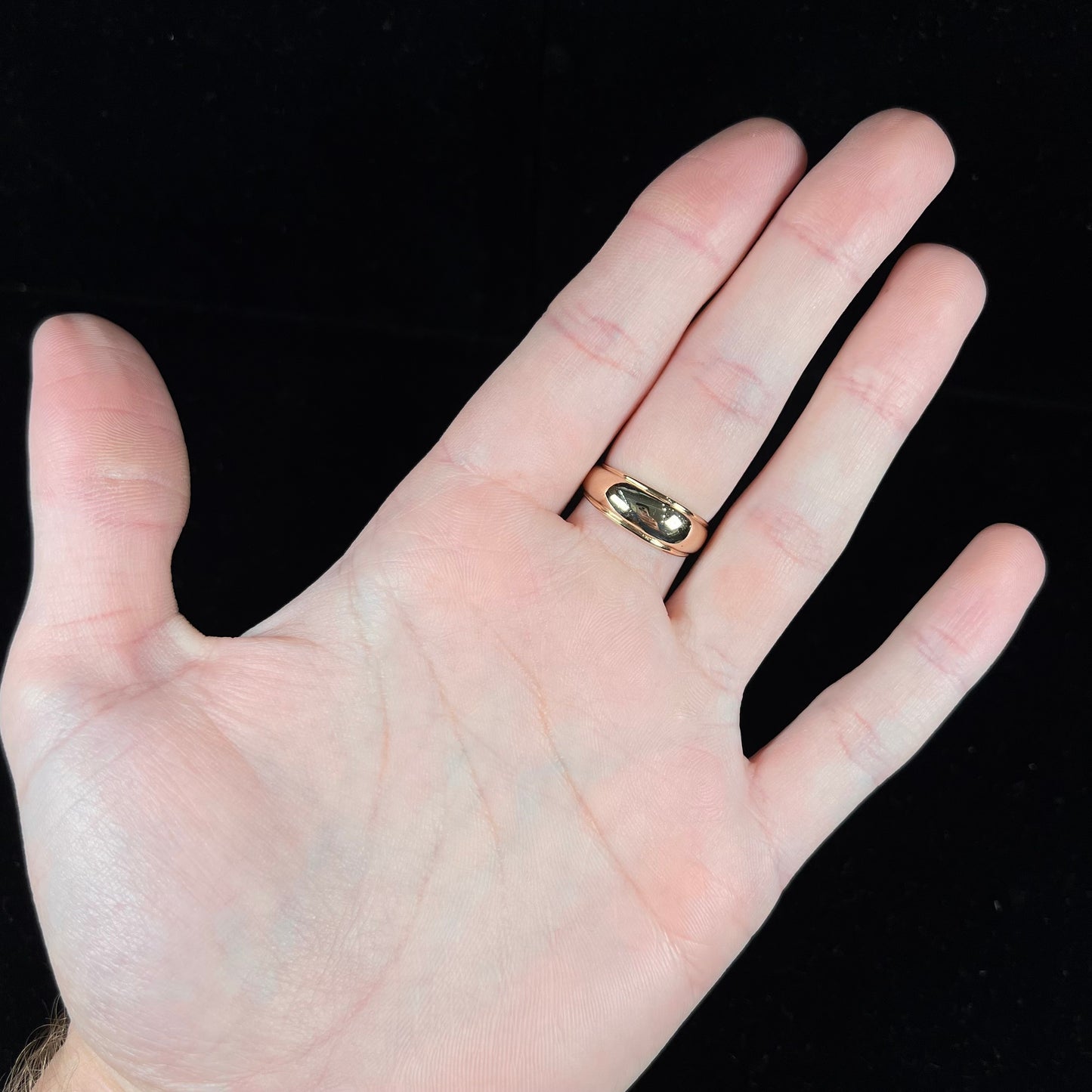 A yellow gold domed diamond ring set with 19 Standard Round Brilliant Cut diamonds.