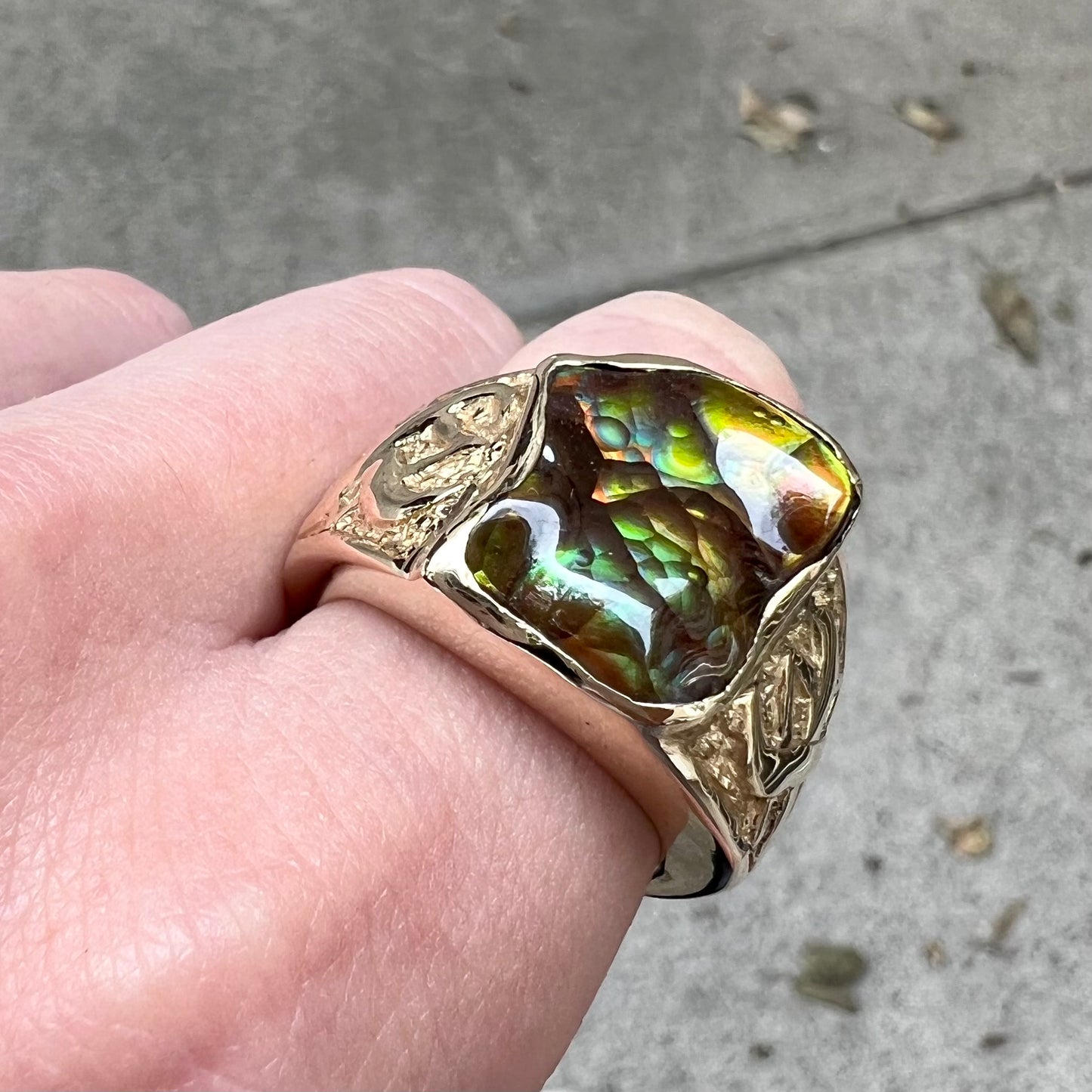 Custom, heavy yellow gold men's ring set with fire agate from Deer Creek, Arizona.