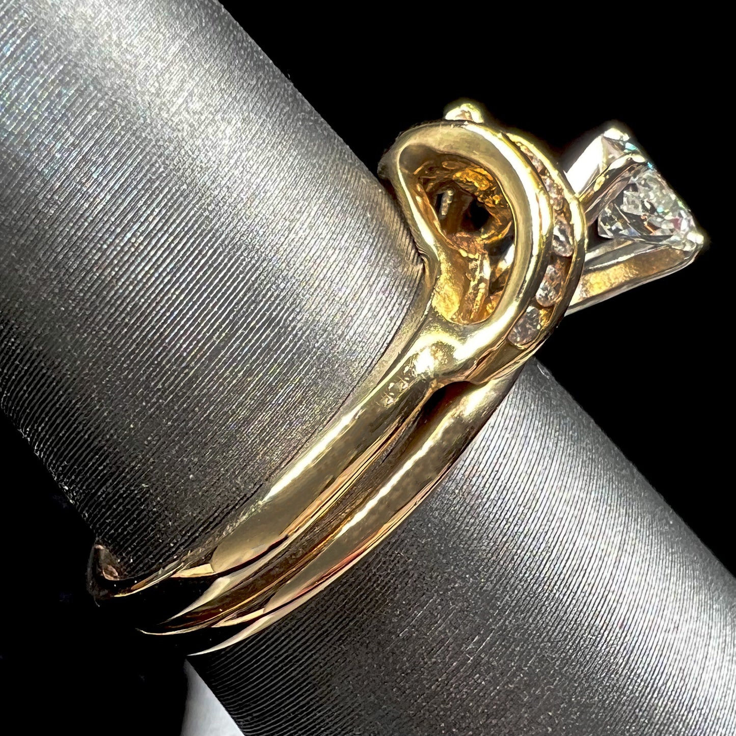 A ladies' diamond wedding set that has been soldered together in yellow gold. There are round and marquise cut diamonds.