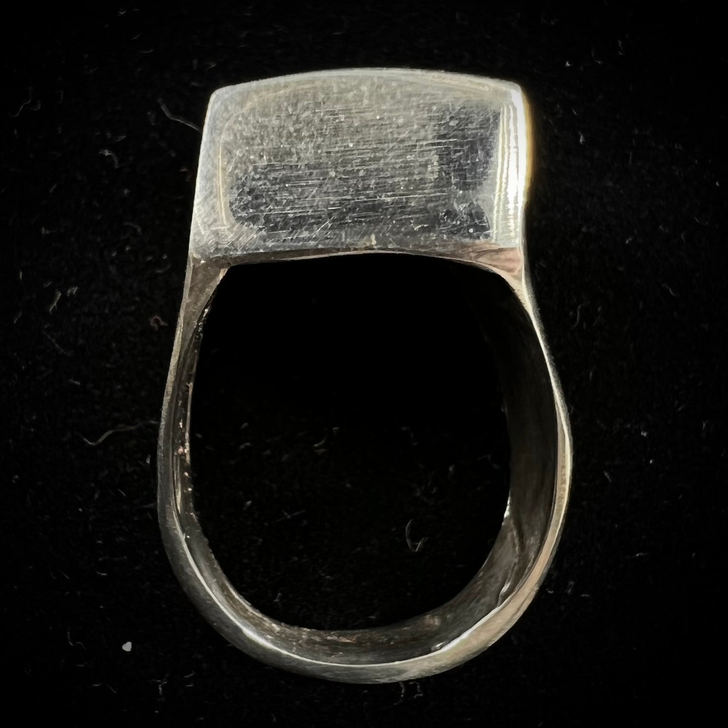 A men's sterling silver turquoise inlay ring, circa 1970. The piece is set with 8 stones.