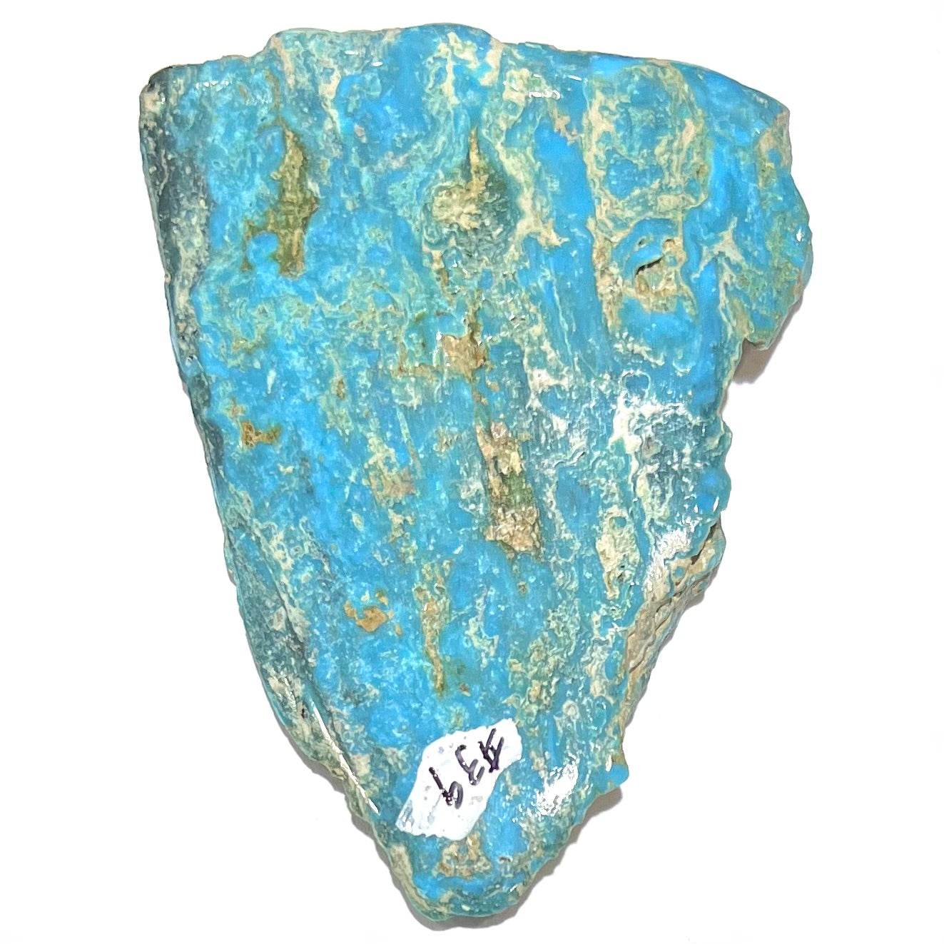 A loose semi-polished rough Sleeping Beauty turquoise stone.