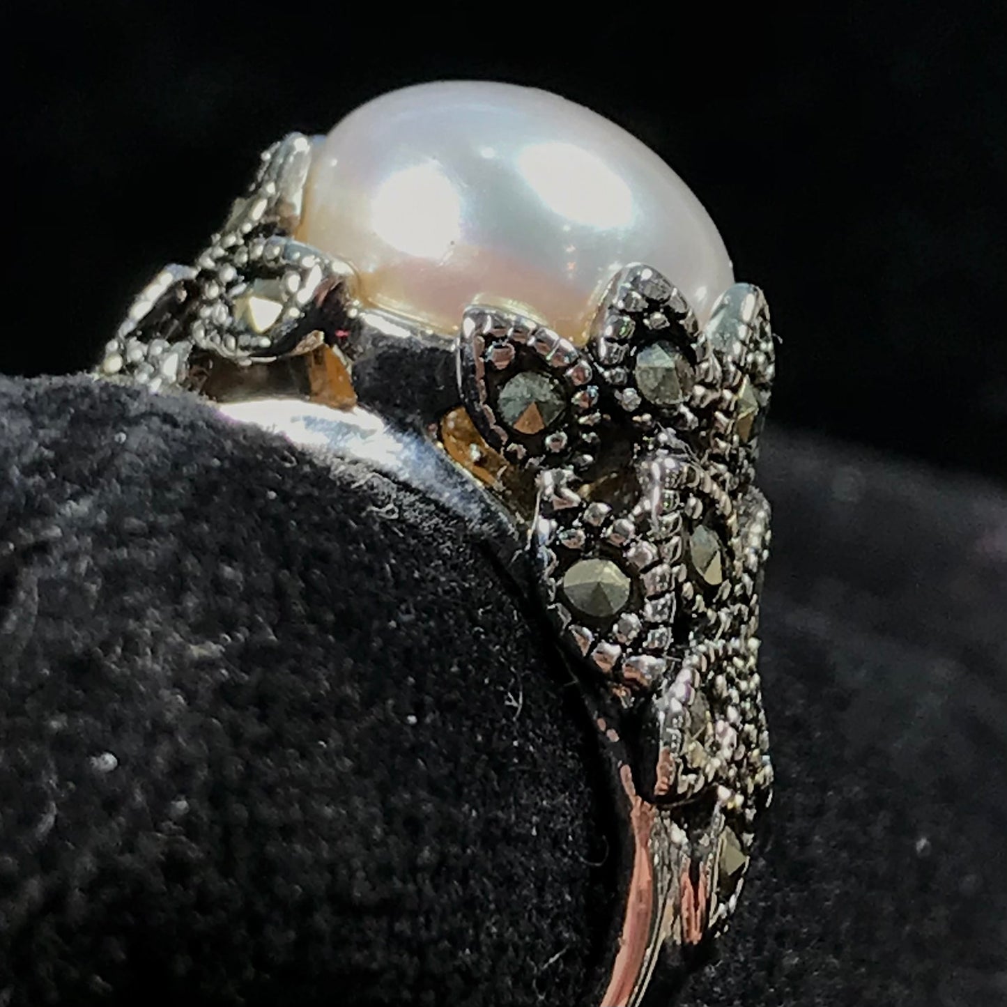 Fresh water pearl ring set in a unique sterling silver cast setting with marcasite.