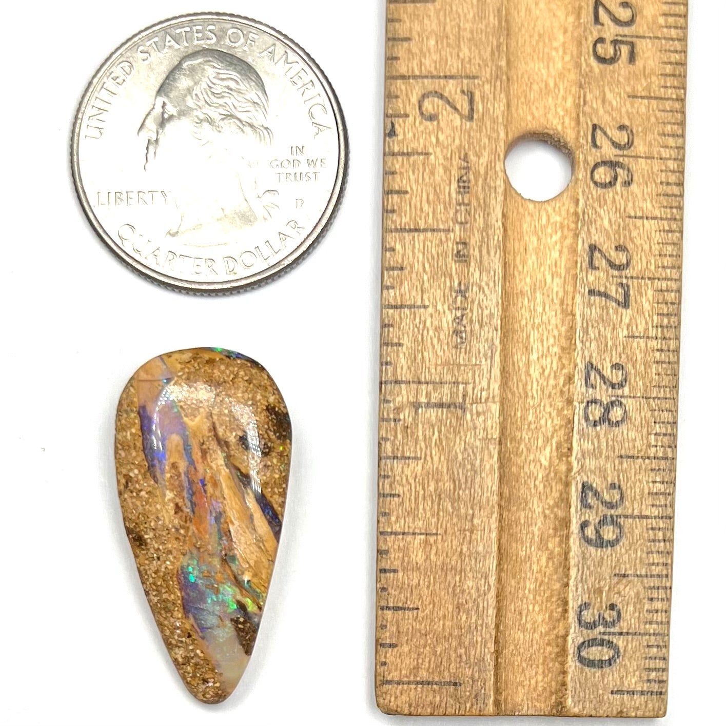 A polished, drilled pipe boulder opal bead.