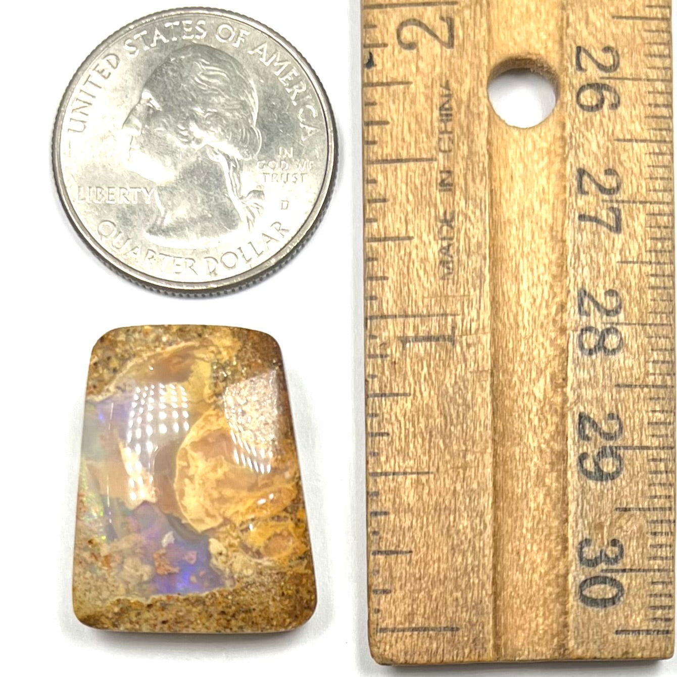 A polished, drilled pipe boulder opal bead.