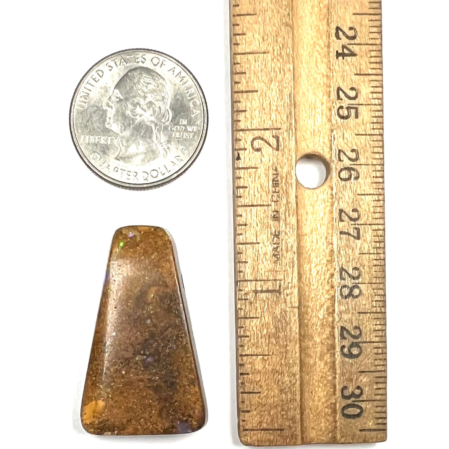 A polished, drilled pipe boulder opal bead.