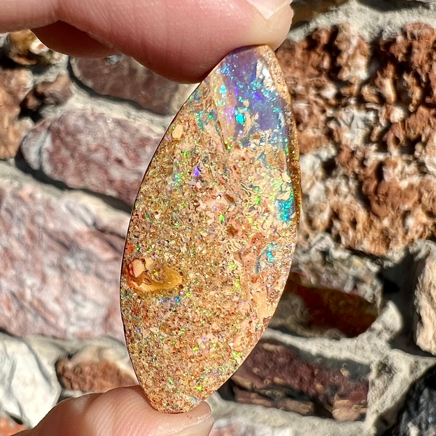 A polished, drilled pipe boulder opal bead.