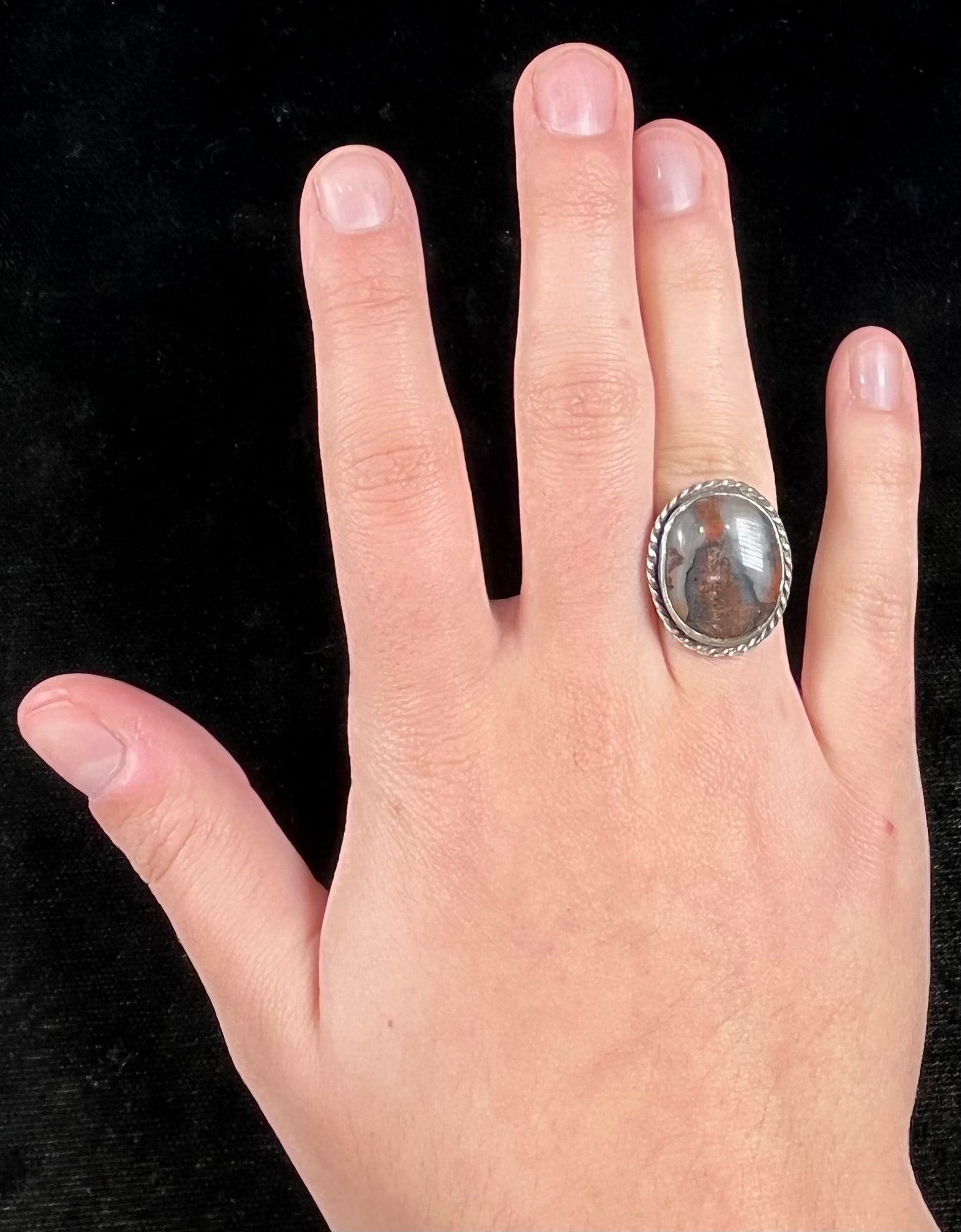 Plume Agate ring set in sterling silver with a twisted rope bezel design.