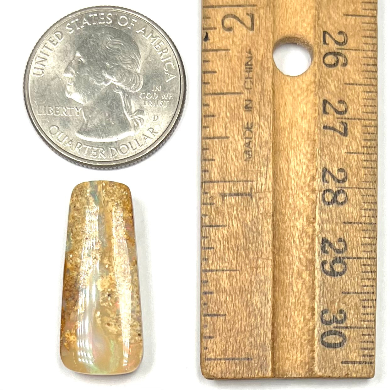 A polished, drilled pipe boulder opal bead.