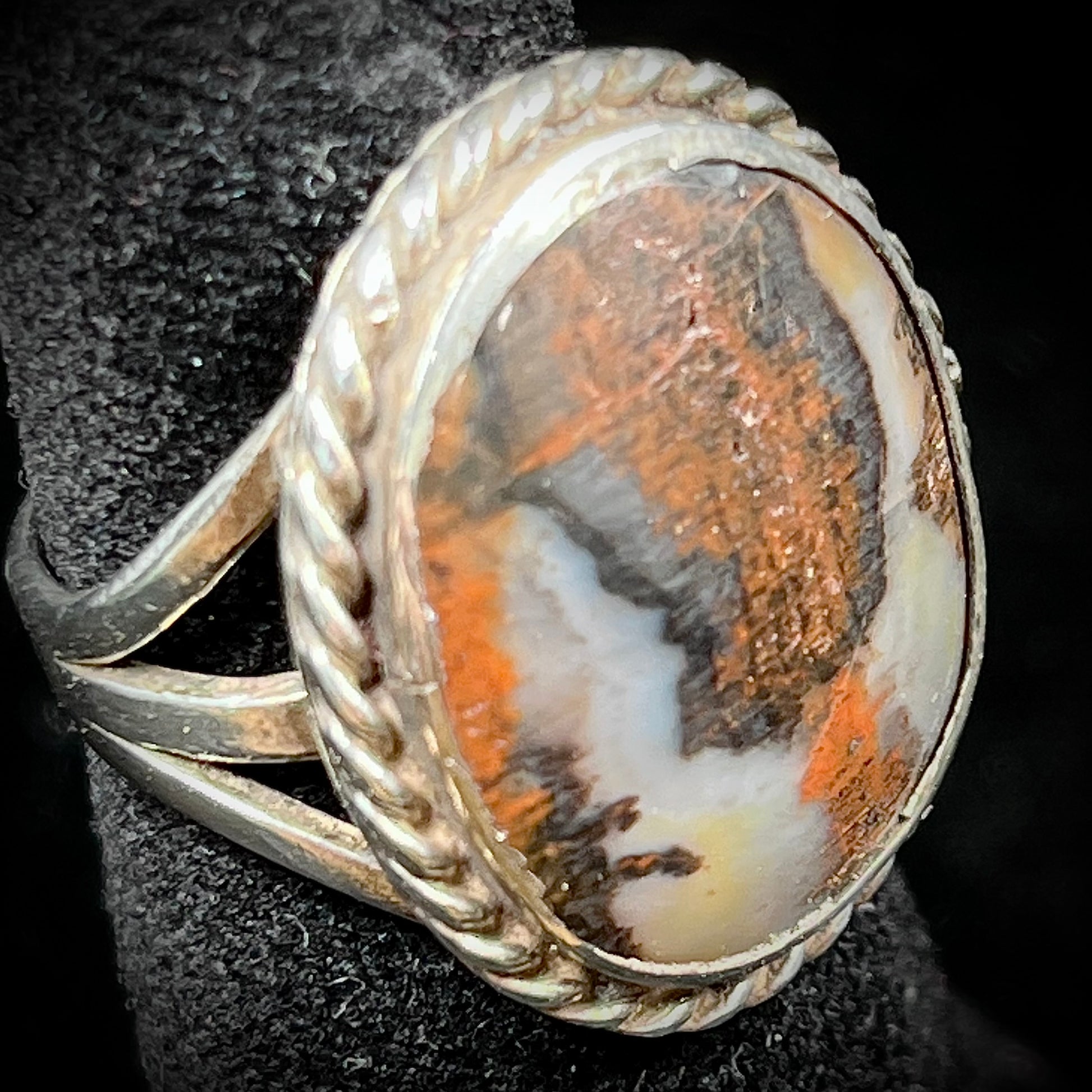 Plume Agate ring set in sterling silver with a twisted rope bezel design.