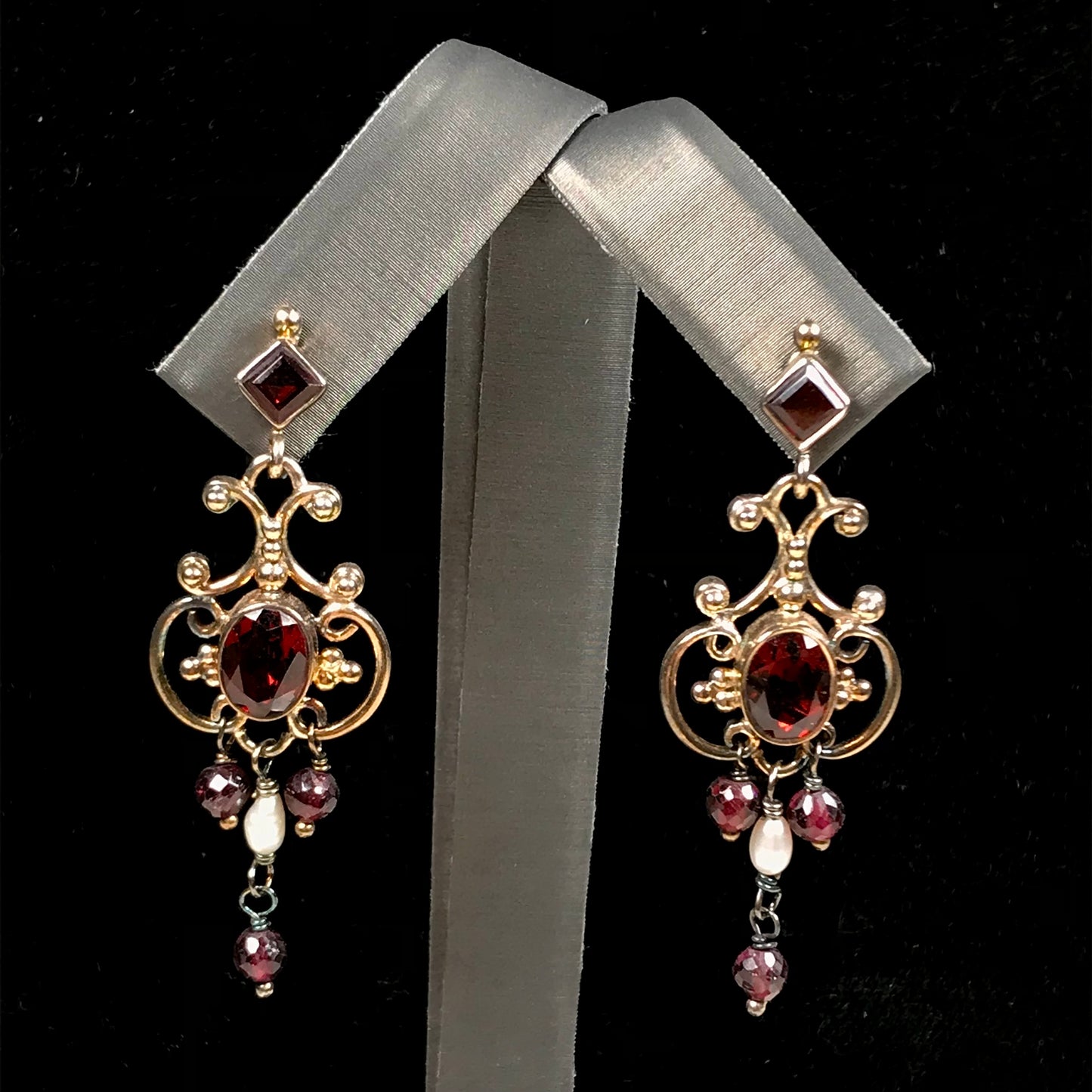 Garnet and pearl silver filigree dangle earrings with post backs.