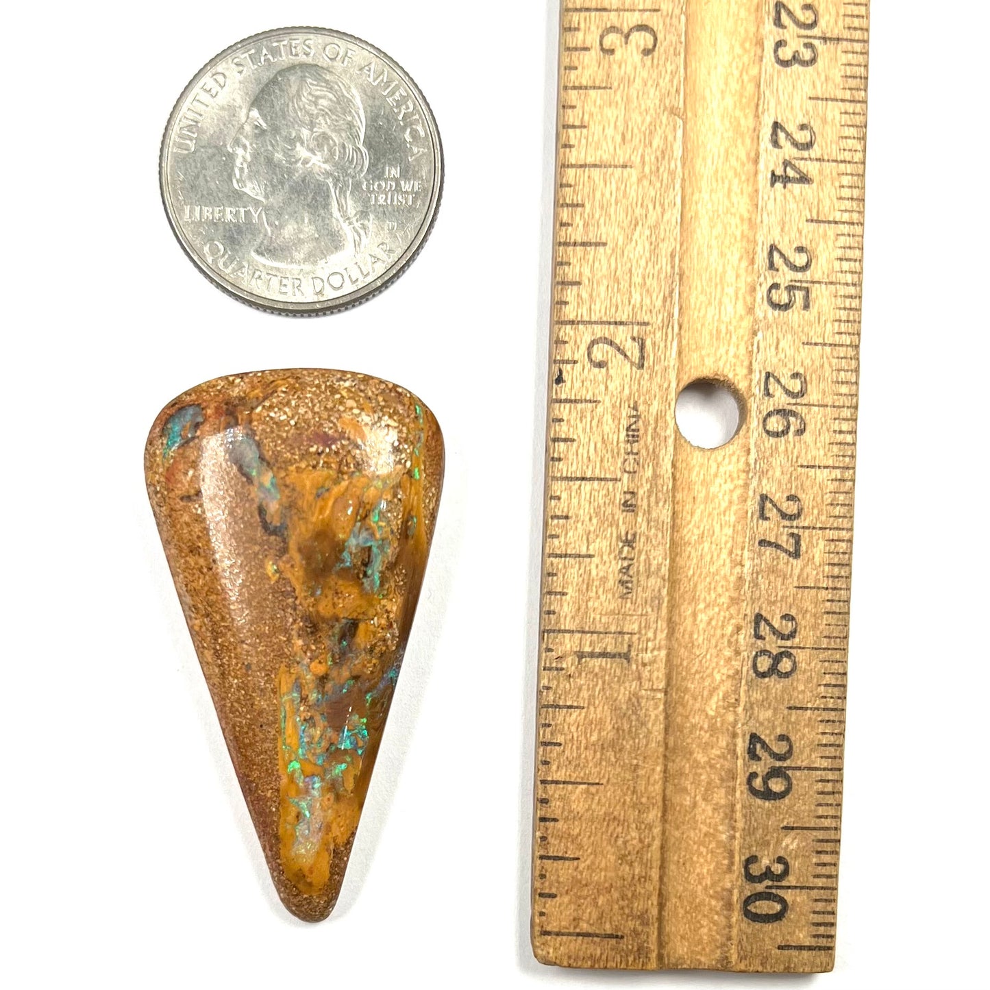 A polished, drilled pipe boulder opal bead.
