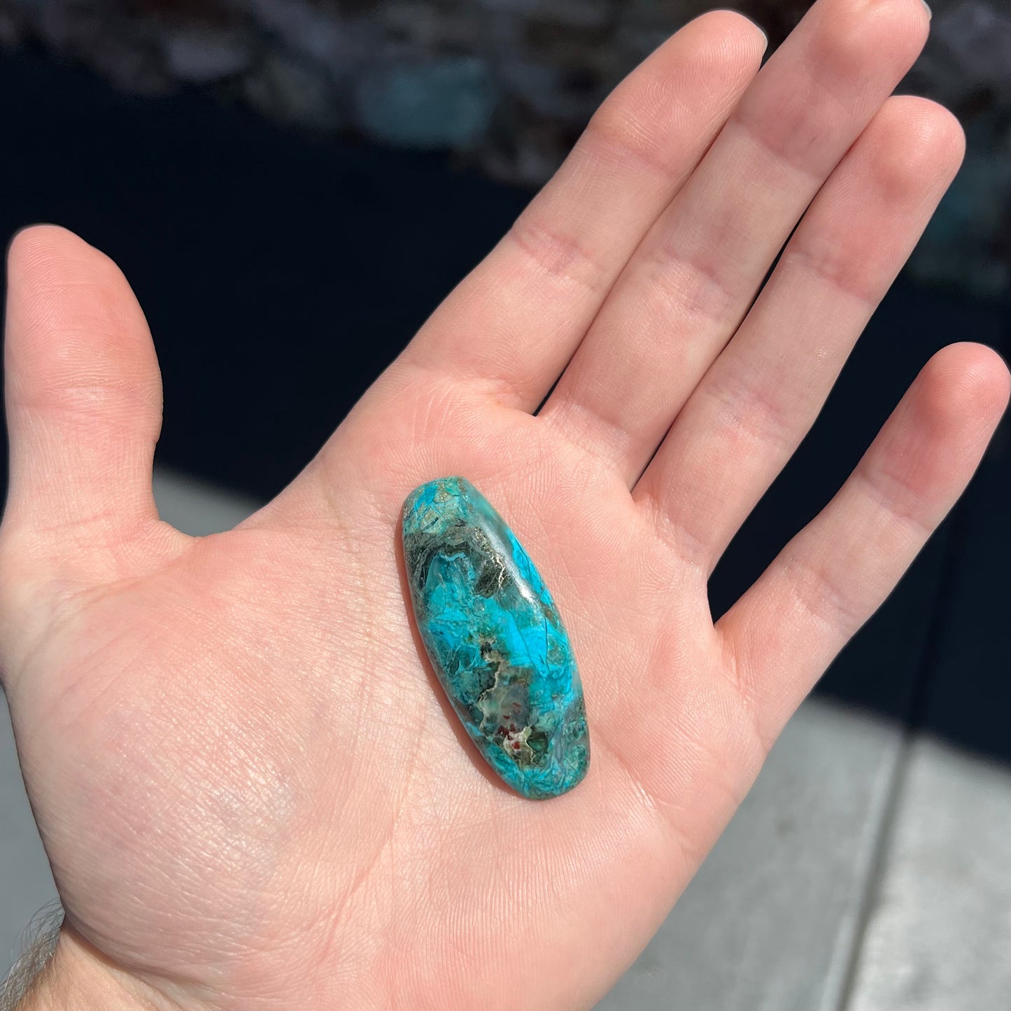 A barrel cabochon cut turquoise from Kingman, Arizona.