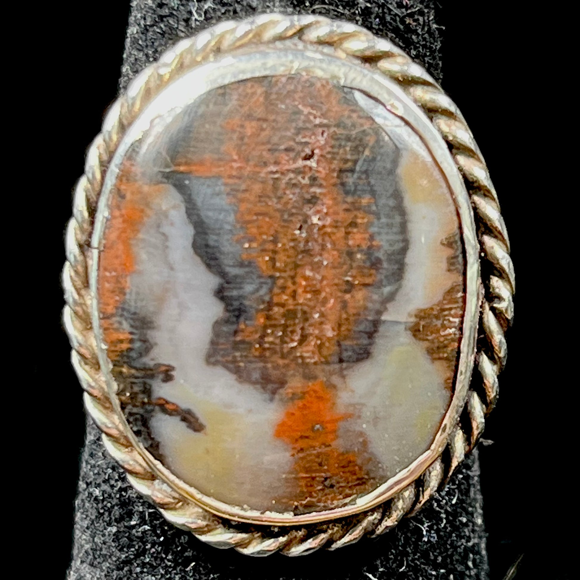 Plume Agate ring set in sterling silver with a twisted rope bezel design.