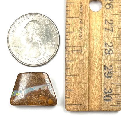 A polished, drilled pipe boulder opal bead.