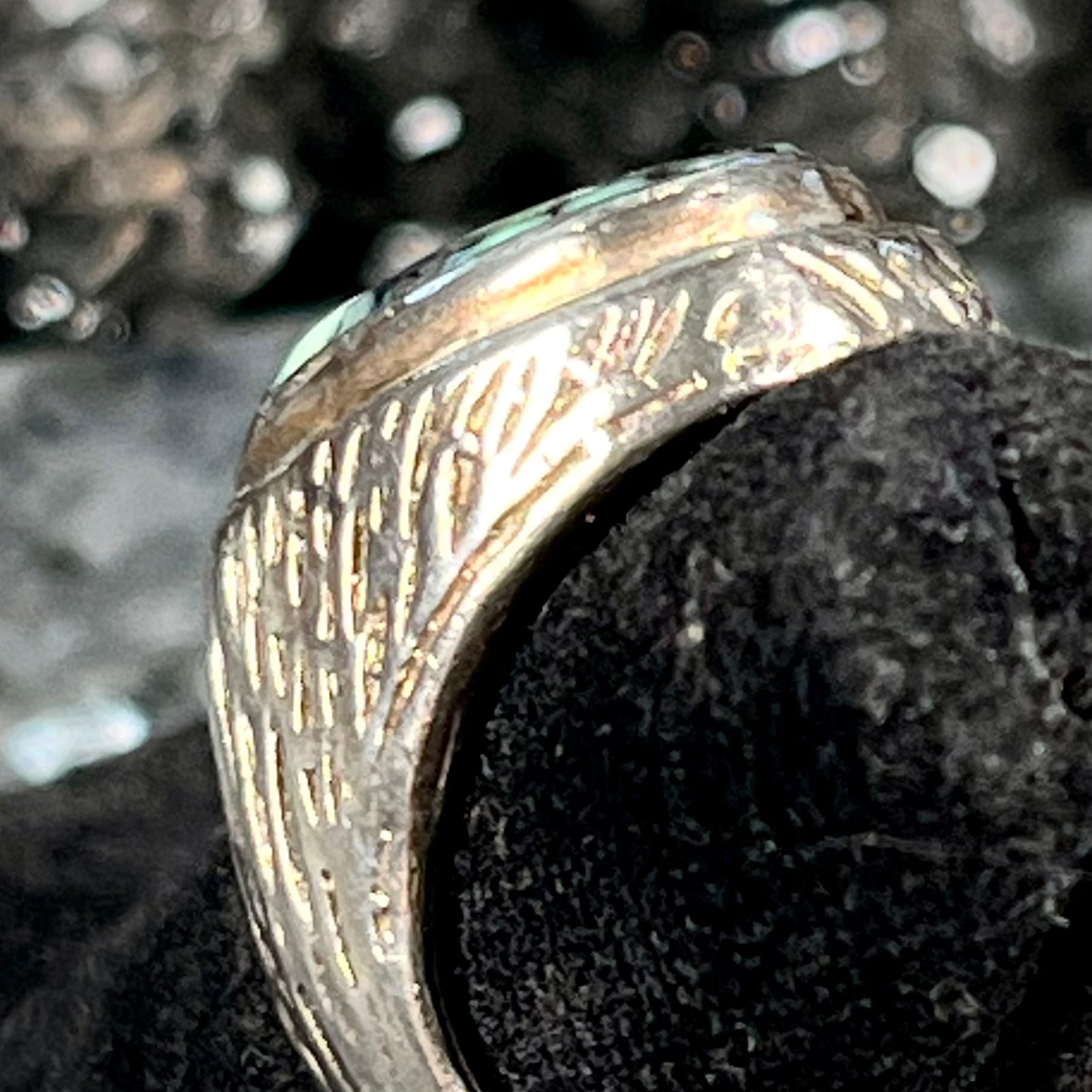 A sterling silver solitaire ring set with a black spiderweb turquoise stone from Kingman, Arizona.