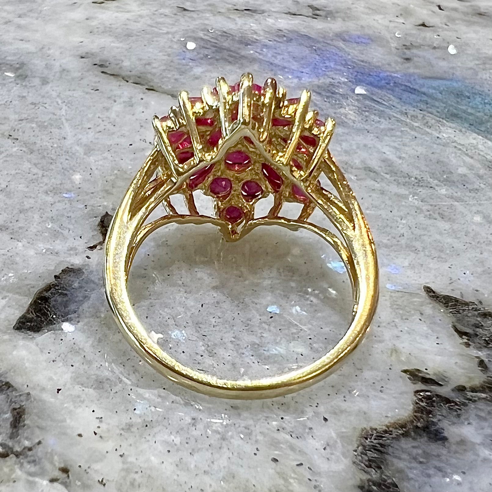 Burma ruby cluster ring set in 14 karat yellow gold.