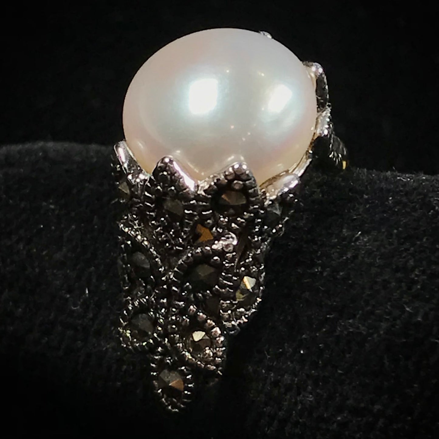 Fresh water pearl ring set in a unique sterling silver cast setting with marcasite.