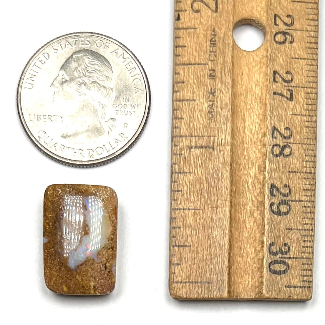 A polished, drilled pipe boulder opal bead.