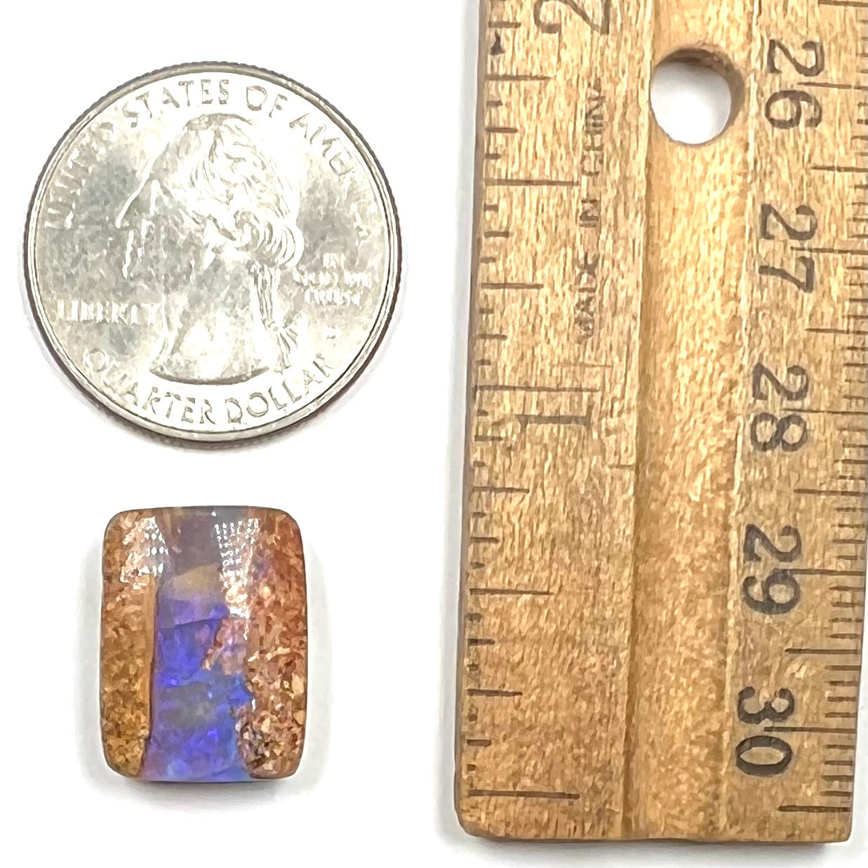 A polished, drilled pipe boulder opal bead.