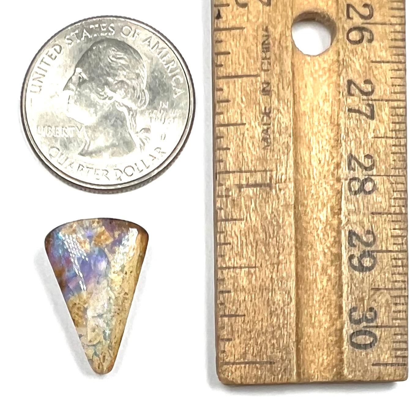 A polished, drilled pipe boulder opal bead.