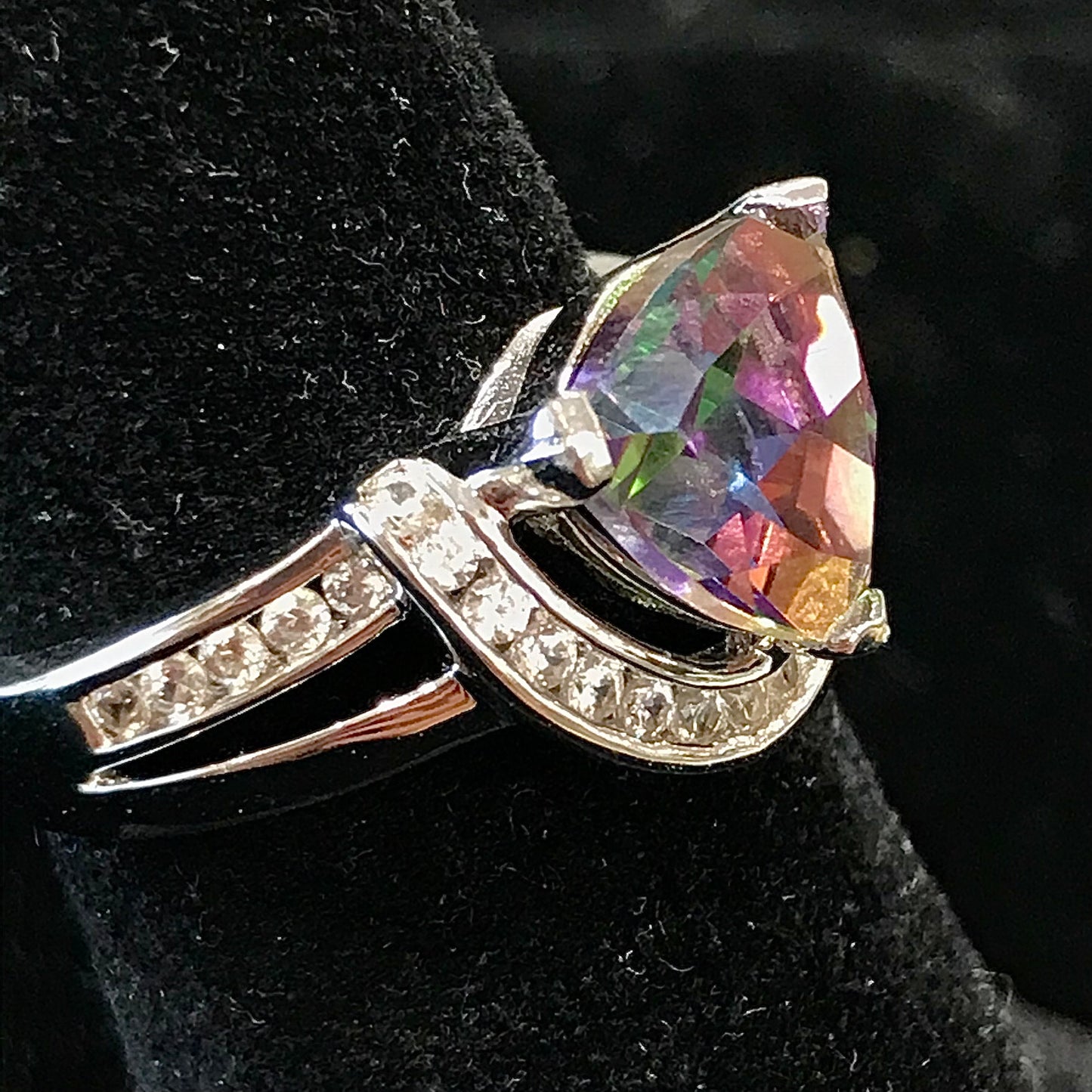 Mystic topaz ring with cubic zirconia side stones set in sterling silver with a double band design.