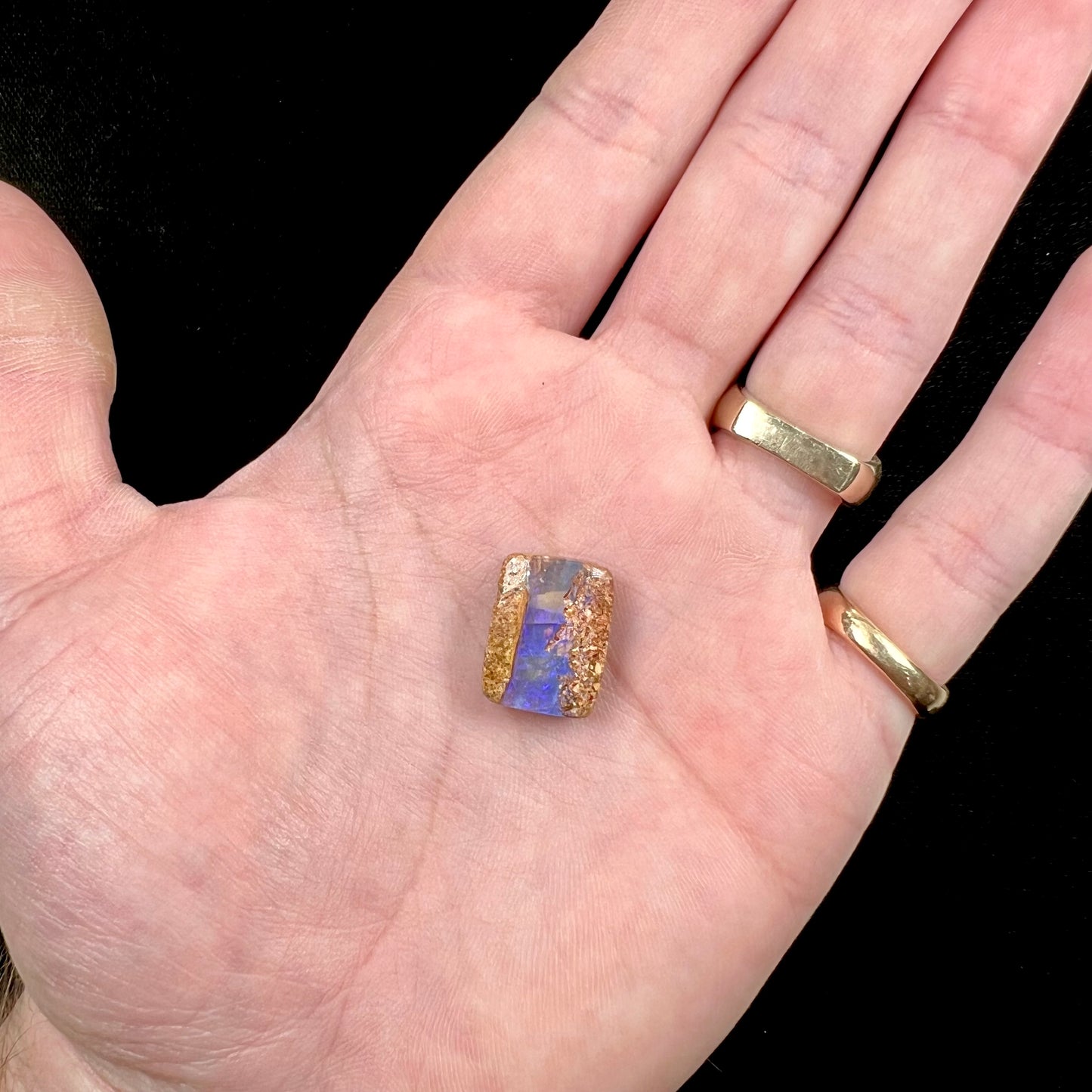 A polished, drilled pipe boulder opal bead.