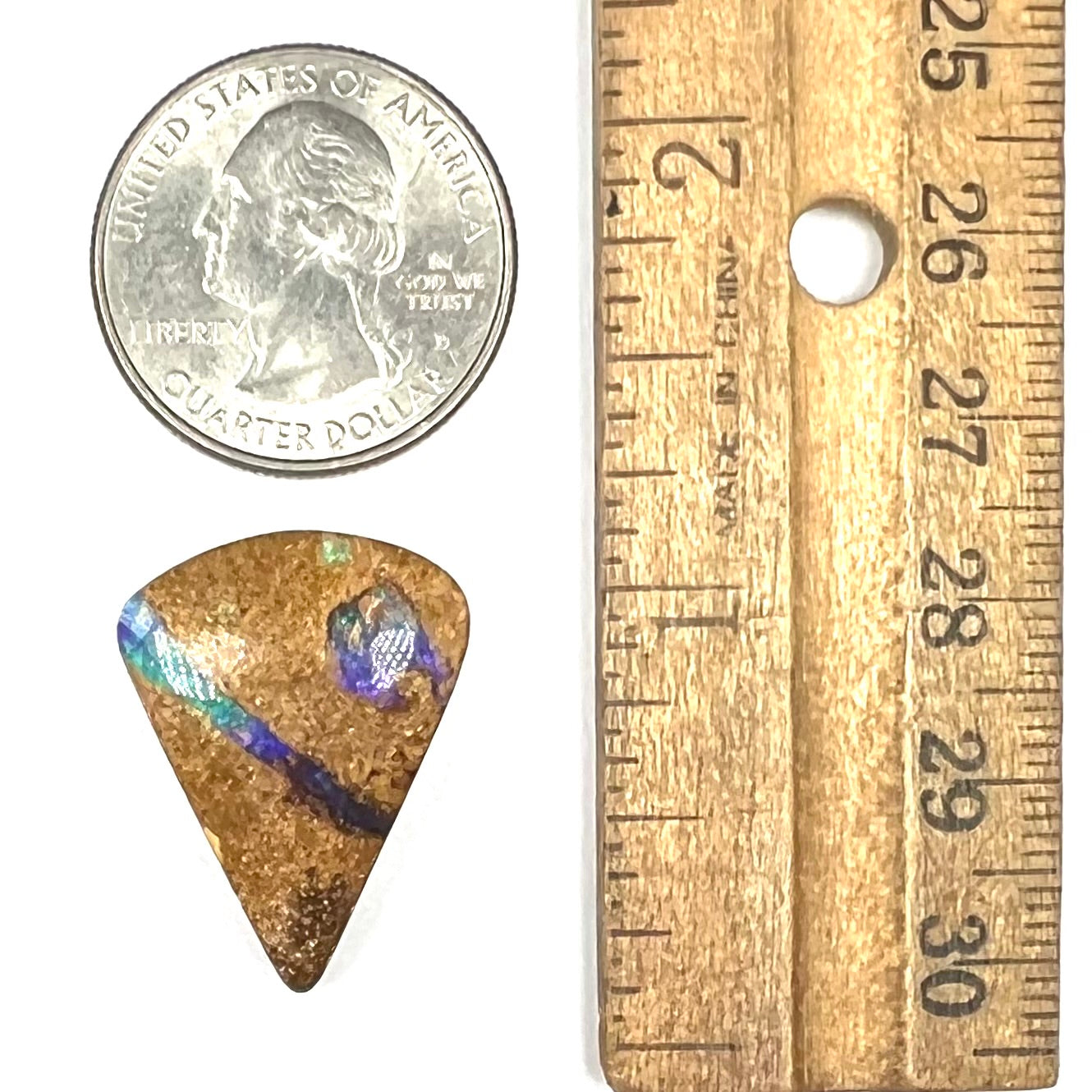 A polished, drilled pipe boulder opal bead.