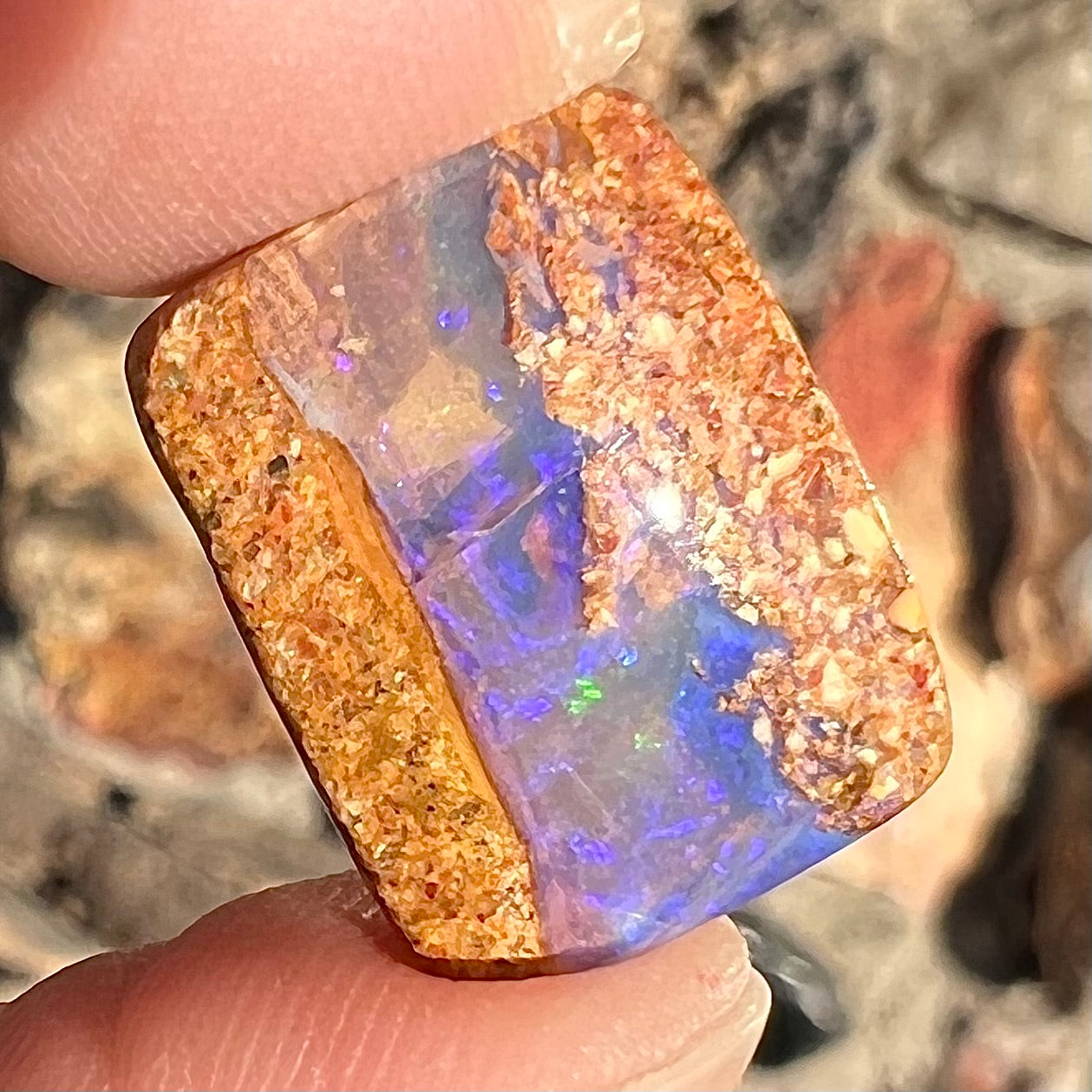 A polished, drilled pipe boulder opal bead.
